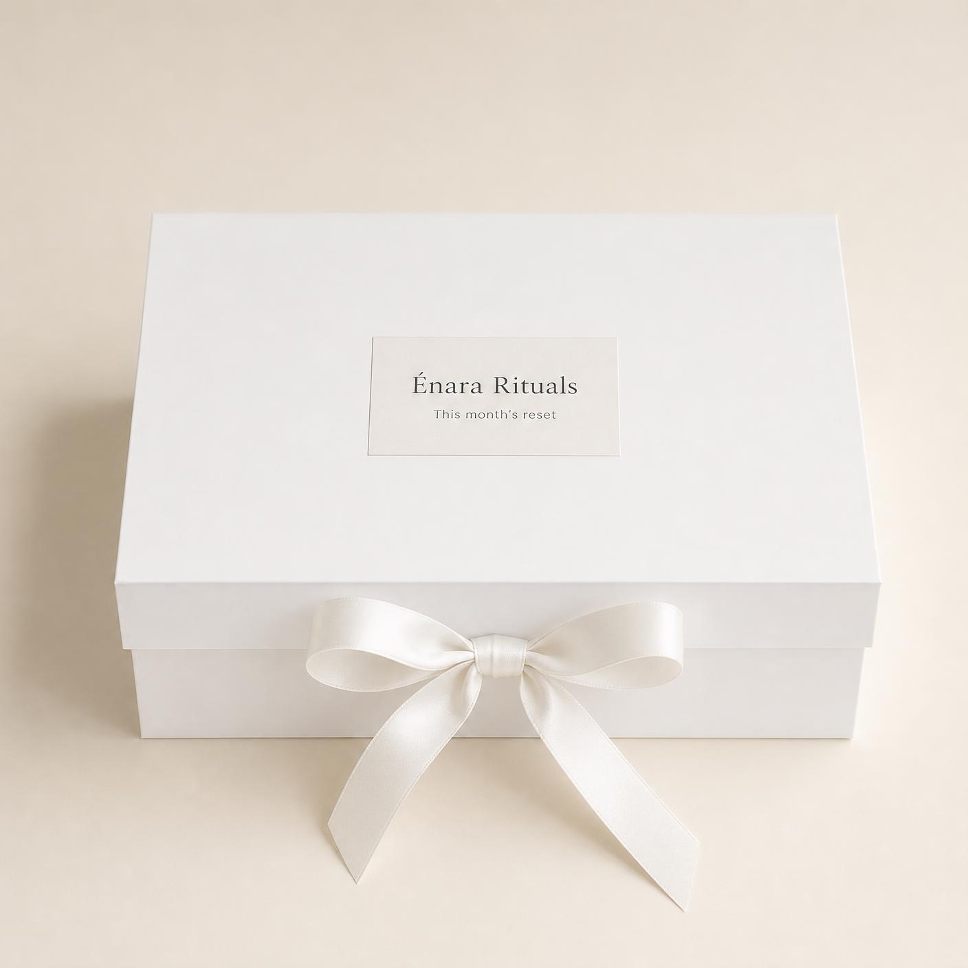 The Monthly Reset Box, closed and tied with a blush ribbon